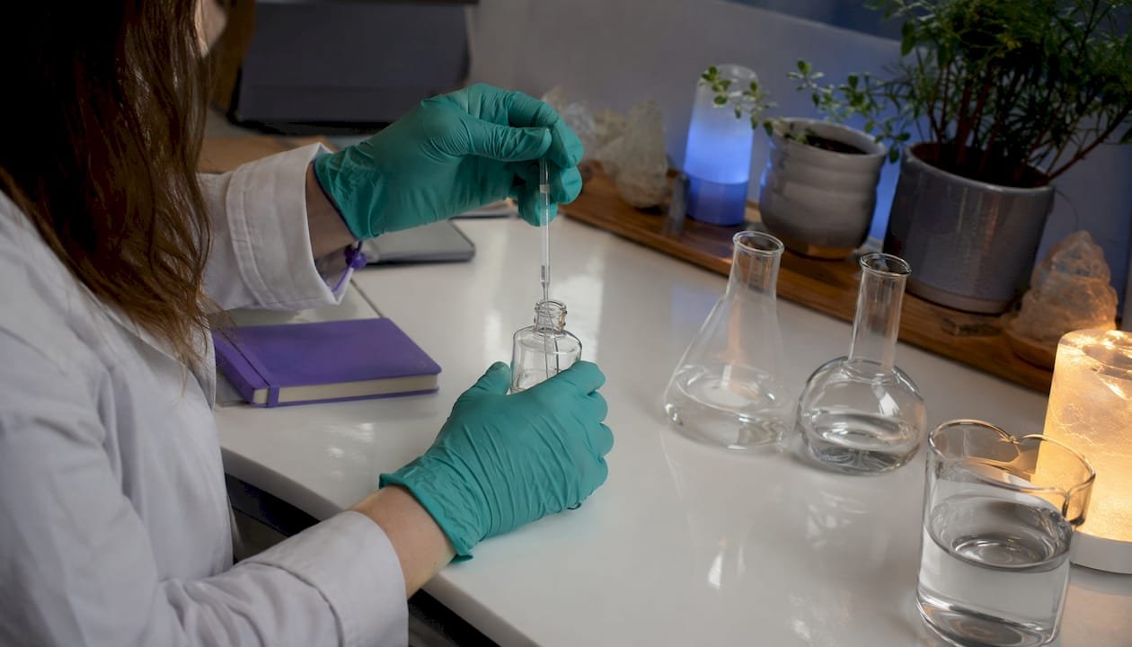 Researchers hands pipetting in angiogenesis lab