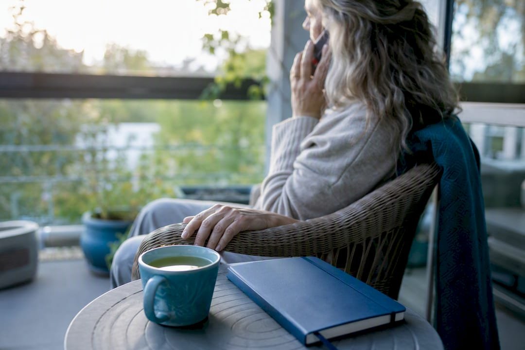 Woman calling doctor in calm home space