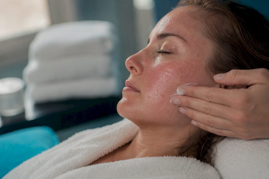 Woman's cheek with mild redness post therapy