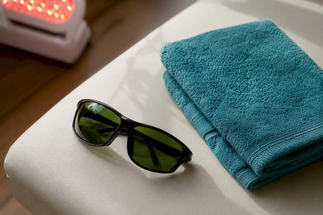 Protective eyewear beside therapy towel