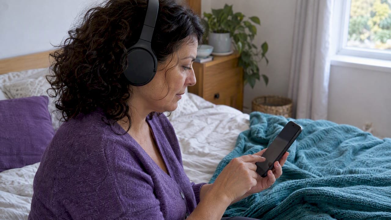 Woman listening to music on headphones