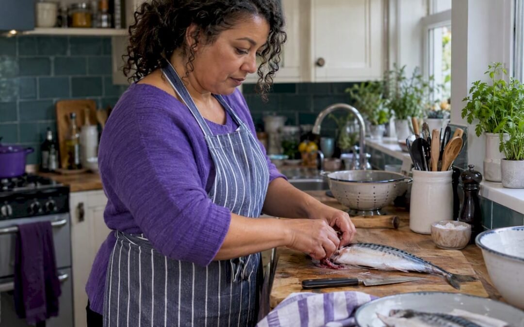 Woman preparing oily fish in an Irish kitchen